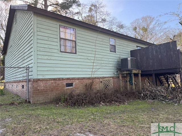 view of side of home featuring crawl space and central air condition unit