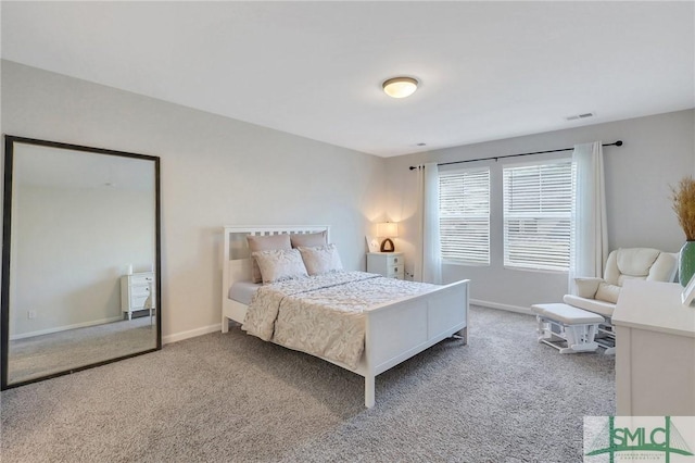 bedroom with visible vents, carpet floors, and baseboards