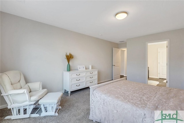 bedroom with visible vents and carpet