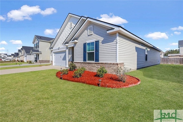 view of side of home with a yard, brick siding, a garage, and concrete driveway