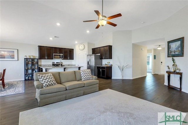 living room with visible vents, recessed lighting, baseboards, ceiling fan, and dark wood-style flooring