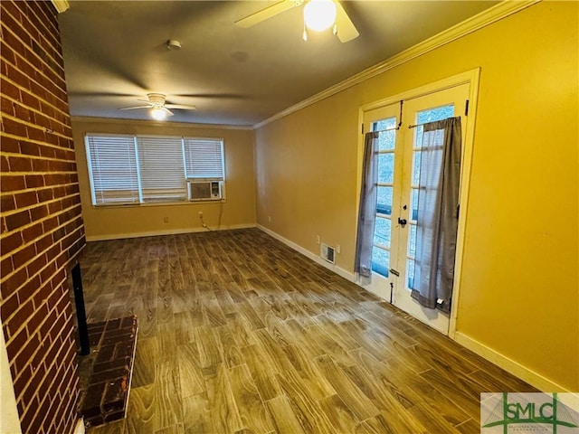 unfurnished room with wood finished floors, a ceiling fan, french doors, and ornamental molding