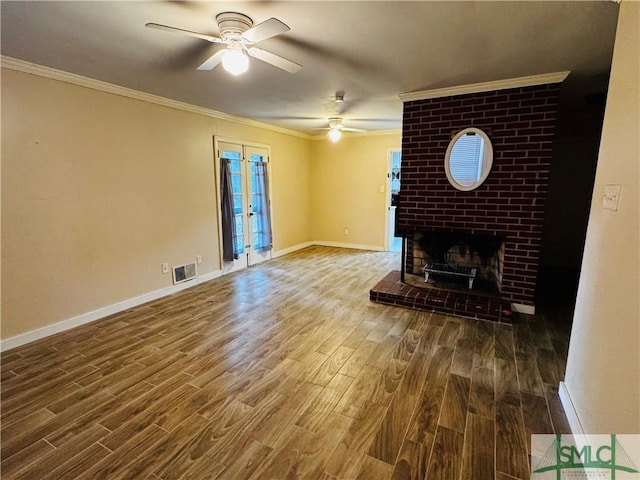 unfurnished living room with wood finished floors, french doors, crown molding, baseboards, and ceiling fan