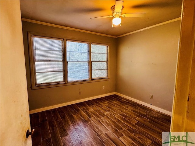 empty room with dark wood finished floors, crown molding, baseboards, and ceiling fan