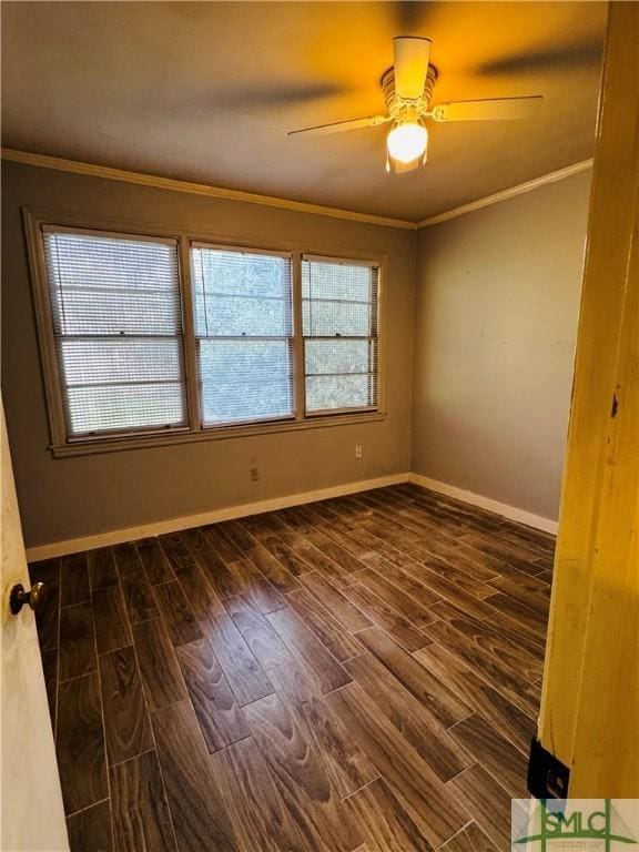 unfurnished room with baseboards, wood finished floors, and ornamental molding