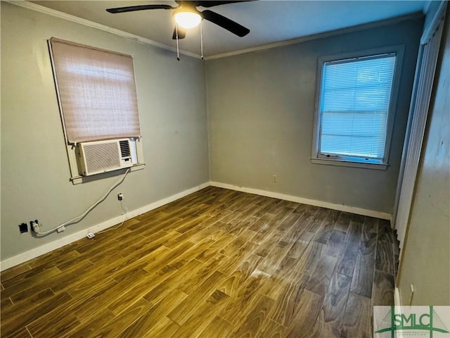 empty room featuring wood finished floors, cooling unit, a ceiling fan, and ornamental molding