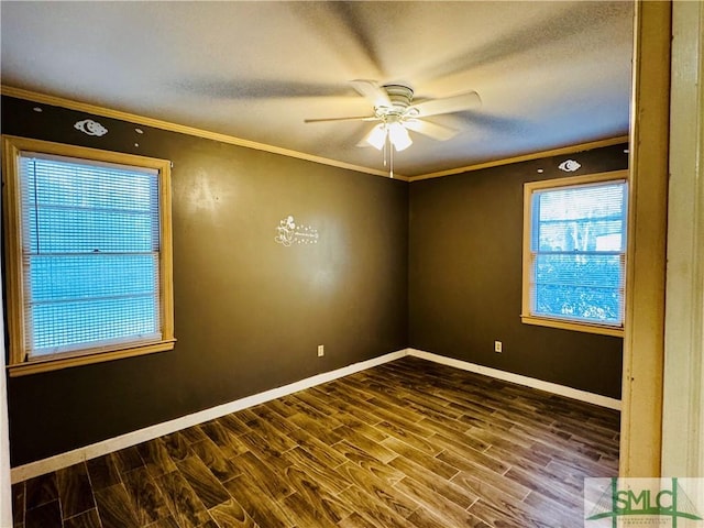 unfurnished room featuring a ceiling fan, wood finished floors, baseboards, and ornamental molding