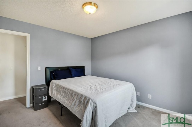 bedroom featuring carpet floors and baseboards
