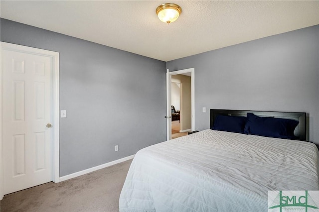 carpeted bedroom with baseboards