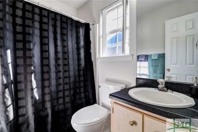 full bathroom with vanity, toilet, and a shower with curtain