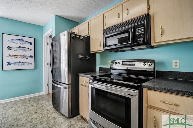 kitchen featuring dark countertops, appliances with stainless steel finishes, and light brown cabinets