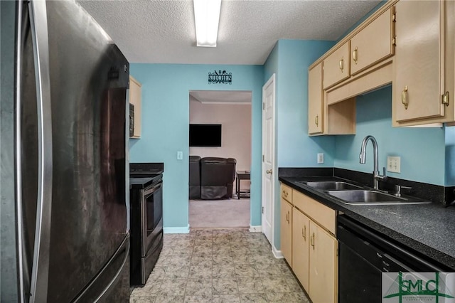 kitchen with a textured ceiling, dark countertops, a sink, baseboards, and stainless steel appliances