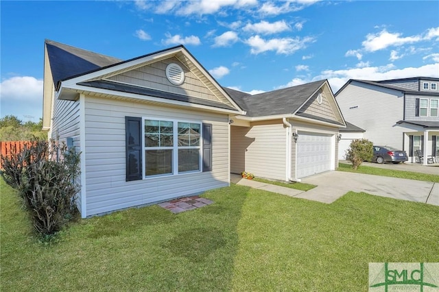 view of front of home with a front yard, concrete driveway, and an attached garage