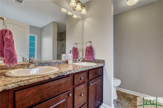 full bath with a sink, visible vents, double vanity, and a shower stall