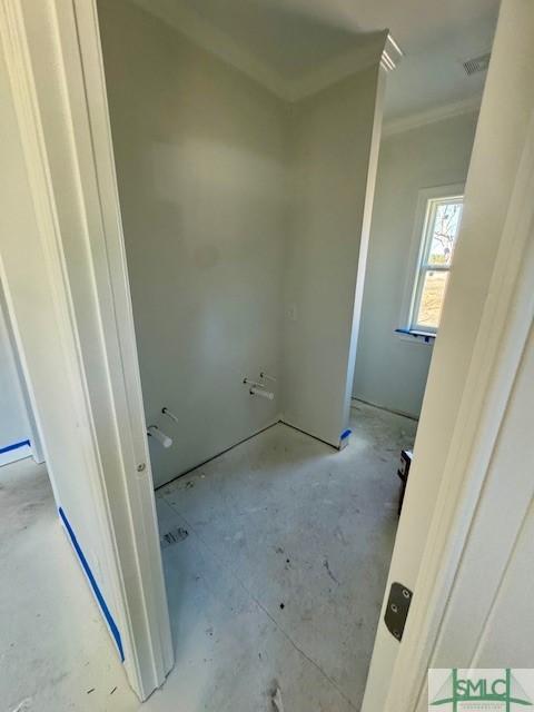 bathroom with crown molding and visible vents