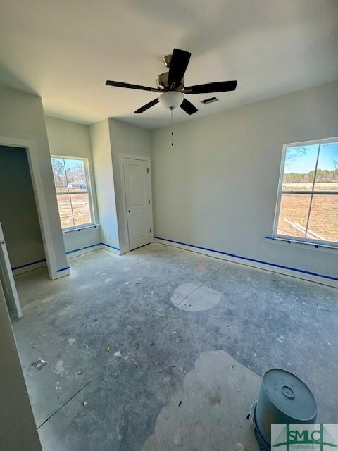 unfurnished bedroom featuring a ceiling fan and visible vents