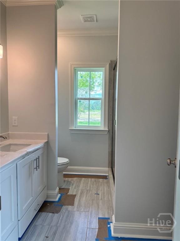 109 Ennis Rd, Pembroke, GA 31321 - full bath with crown molding, vanity, an enclosed shower, and wood finished floors