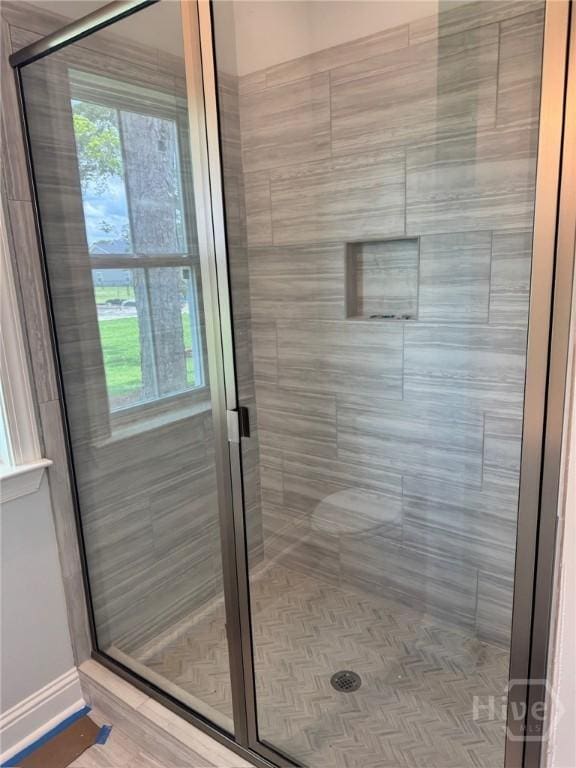 109 Ennis Rd, Pembroke, GA 31321 - bathroom with healthy amount of natural light and a shower stall