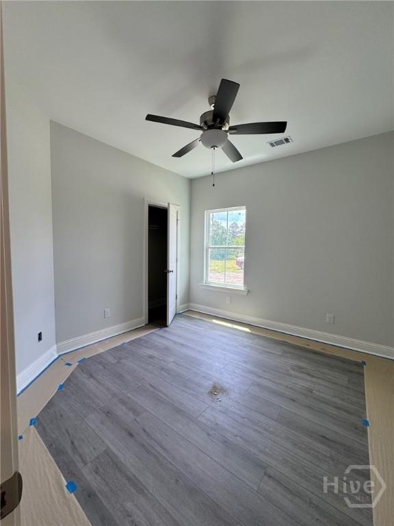 109 Ennis Rd, Pembroke, GA 31321 - unfurnished room with a ceiling fan and wood finished floors