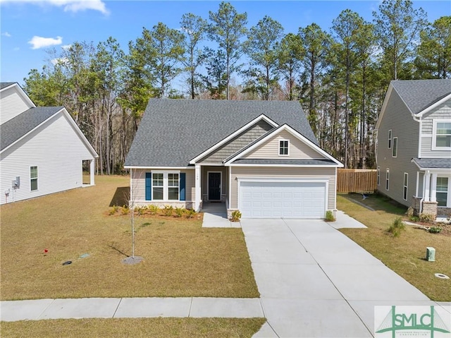 craftsman house with a front lawn, an attached garage, and concrete driveway