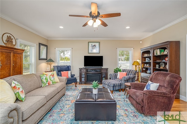 living room with recessed lighting, crown molding, ceiling fan, and wood finished floors