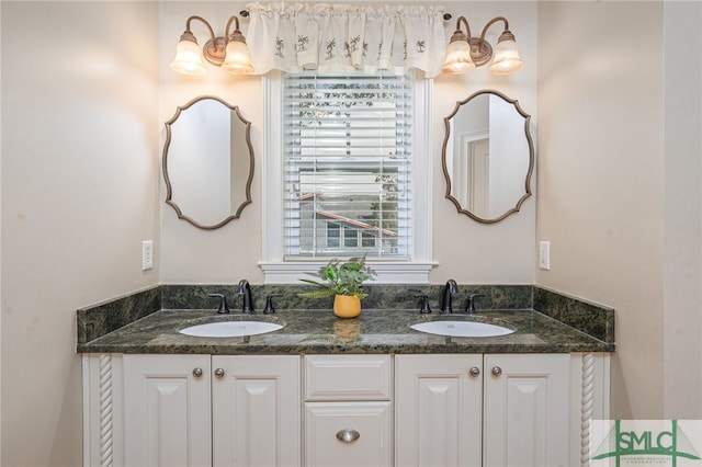 full bathroom with a sink and double vanity