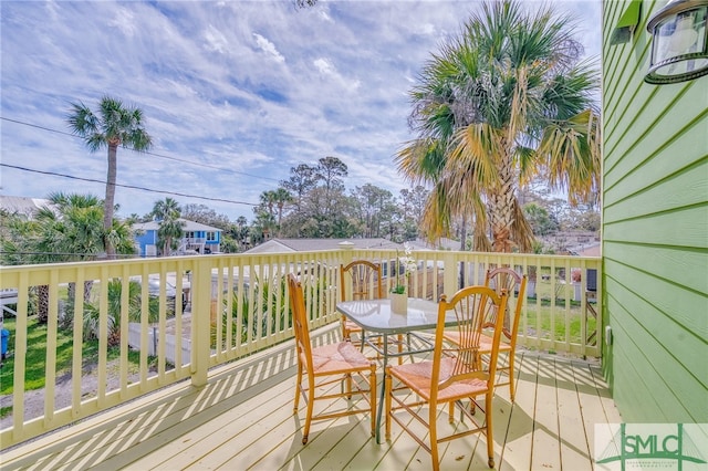 wooden deck with outdoor dining space