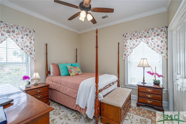 bedroom with visible vents, baseboards, a ceiling fan, and ornamental molding