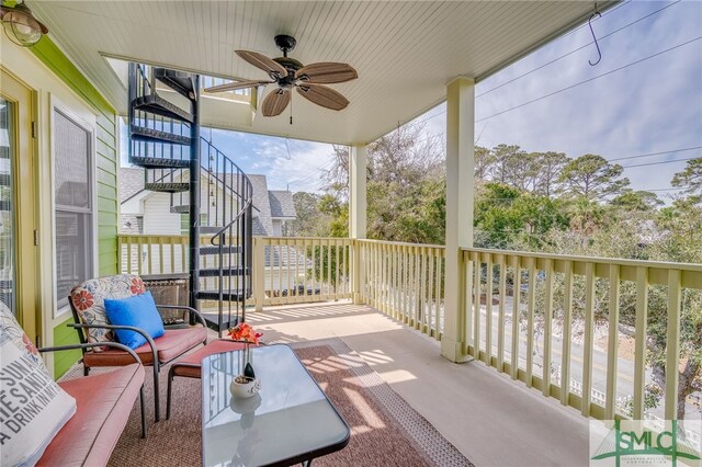 view of patio / terrace featuring stairway and ceiling fan