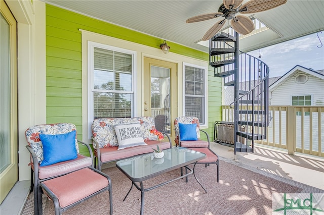 view of patio featuring stairs and ceiling fan