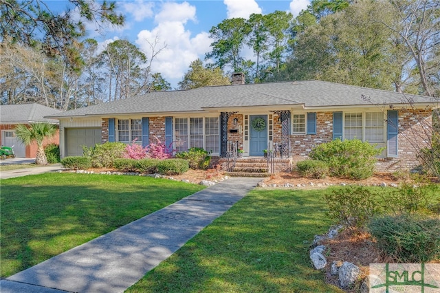 ranch-style house featuring a front yard, an attached garage, brick siding, and a chimney