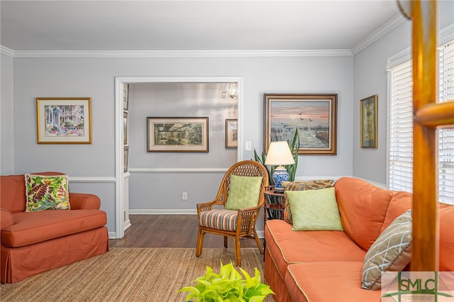 living area featuring wood finished floors, baseboards, and ornamental molding