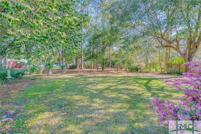 view of yard featuring fence