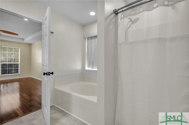 bathroom featuring a shower with curtain, a bath, recessed lighting, and ceiling fan