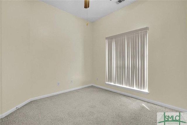 empty room with baseboards, ceiling fan, and carpet flooring