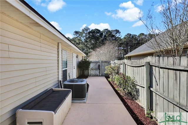 view of patio / terrace featuring central AC unit and a fenced backyard