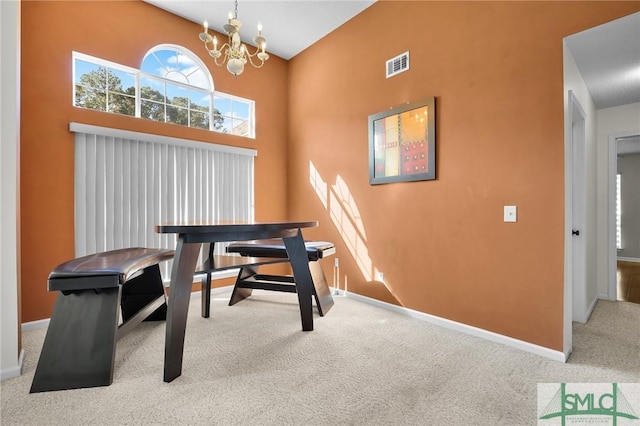 office area with a chandelier, visible vents, baseboards, and carpet