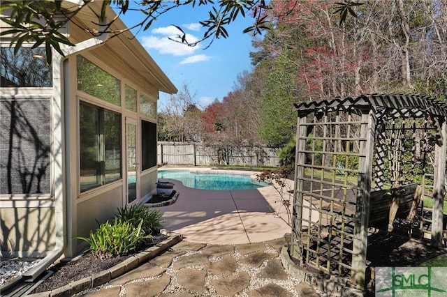 view of swimming pool with a patio area, a fenced backyard, and a fenced in pool