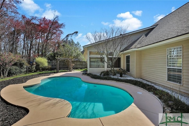 view of swimming pool with a patio, a fenced in pool, and fence