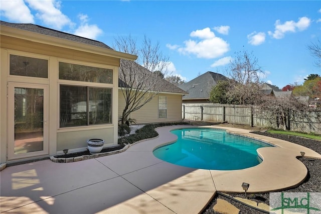 view of pool featuring a patio, a fenced in pool, and a fenced backyard