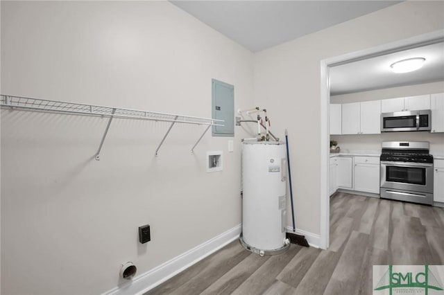 laundry area with light wood-type flooring, electric panel, water heater, baseboards, and laundry area