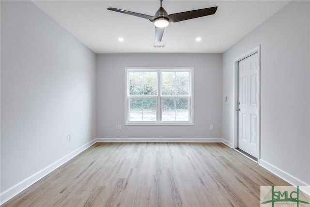 unfurnished bedroom featuring visible vents, a ceiling fan, baseboards, and wood finished floors