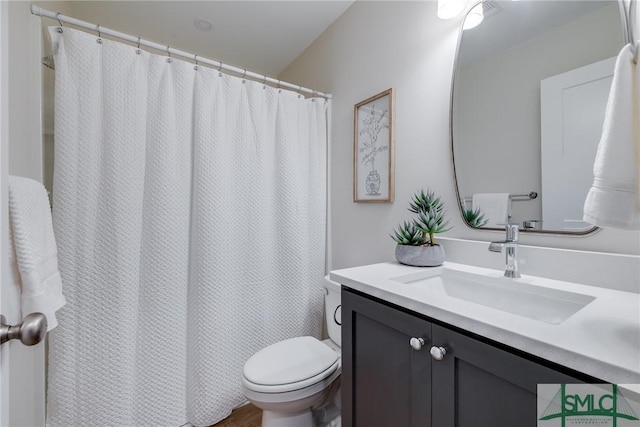 1323 E 69th St, Savannah, GA 31404 - bathroom with vanity, toilet, and a shower with shower curtain