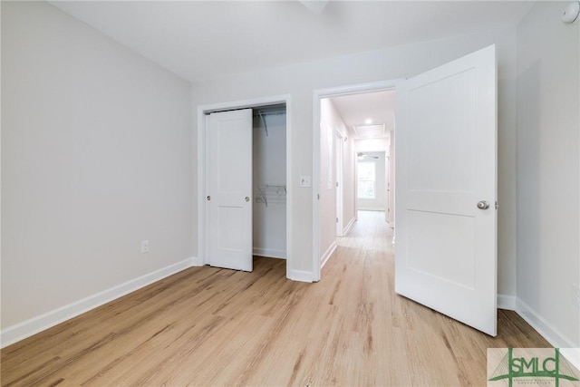 1323 E 69th St, Savannah, GA 31404 - unfurnished bedroom featuring light wood-style floors, baseboards, and a closet
