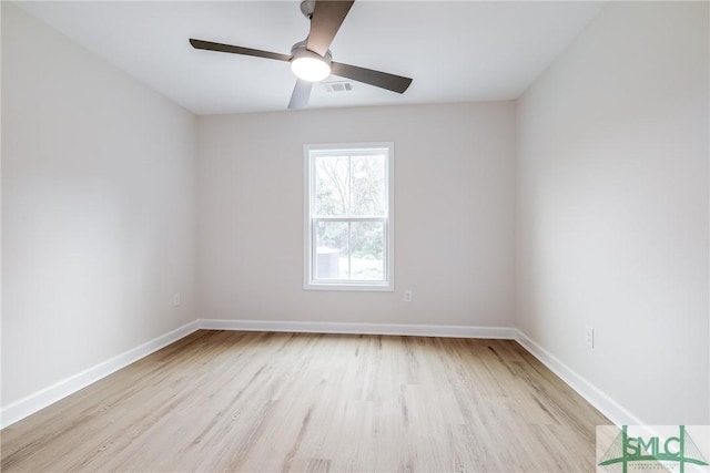 1323 E 69th St, Savannah, GA 31404 - empty room featuring wood finished floors, baseboards, and ceiling fan
