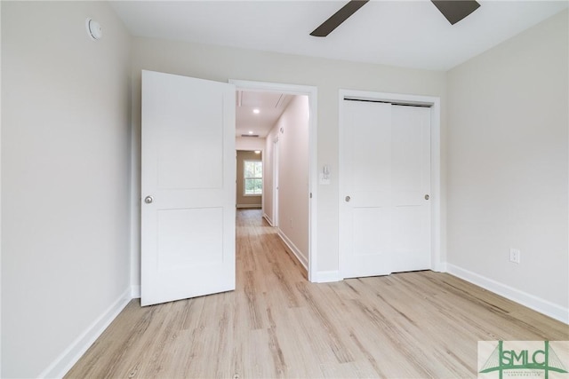 1323 E 69th St, Savannah, GA 31404 - unfurnished bedroom featuring light wood finished floors, attic access, baseboards, and a closet