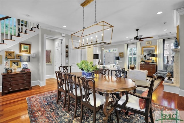 dining space featuring recessed lighting, crown molding, ceiling fan, and wood finished floors