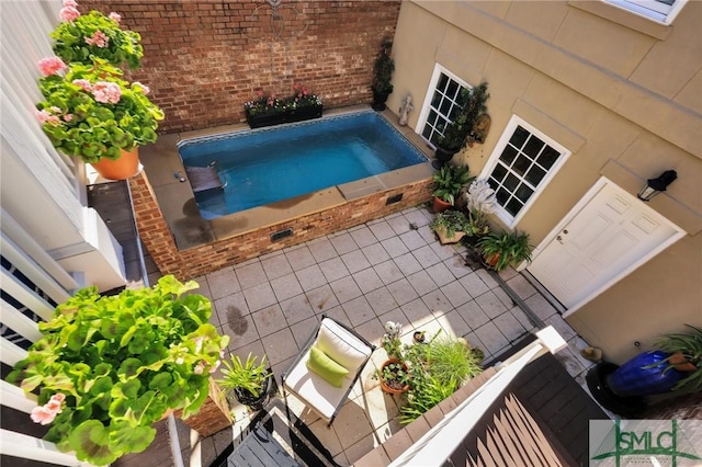 view of swimming pool with a jacuzzi