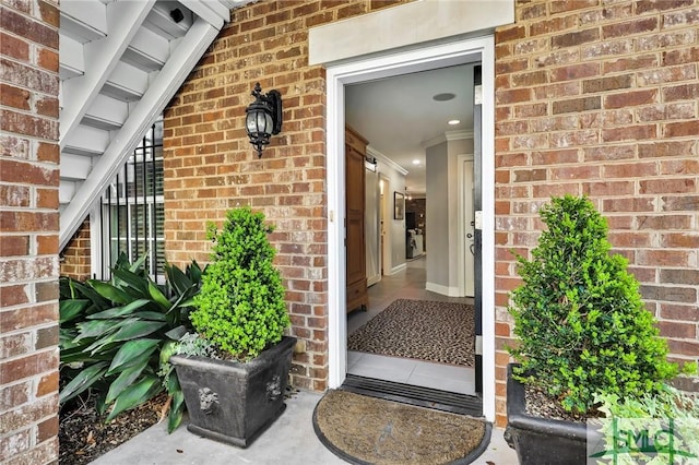 property entrance with brick siding