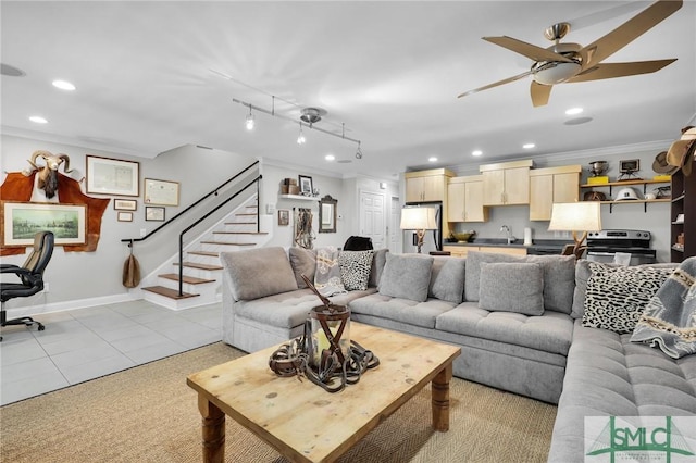 living area with baseboards, recessed lighting, ceiling fan, stairs, and crown molding